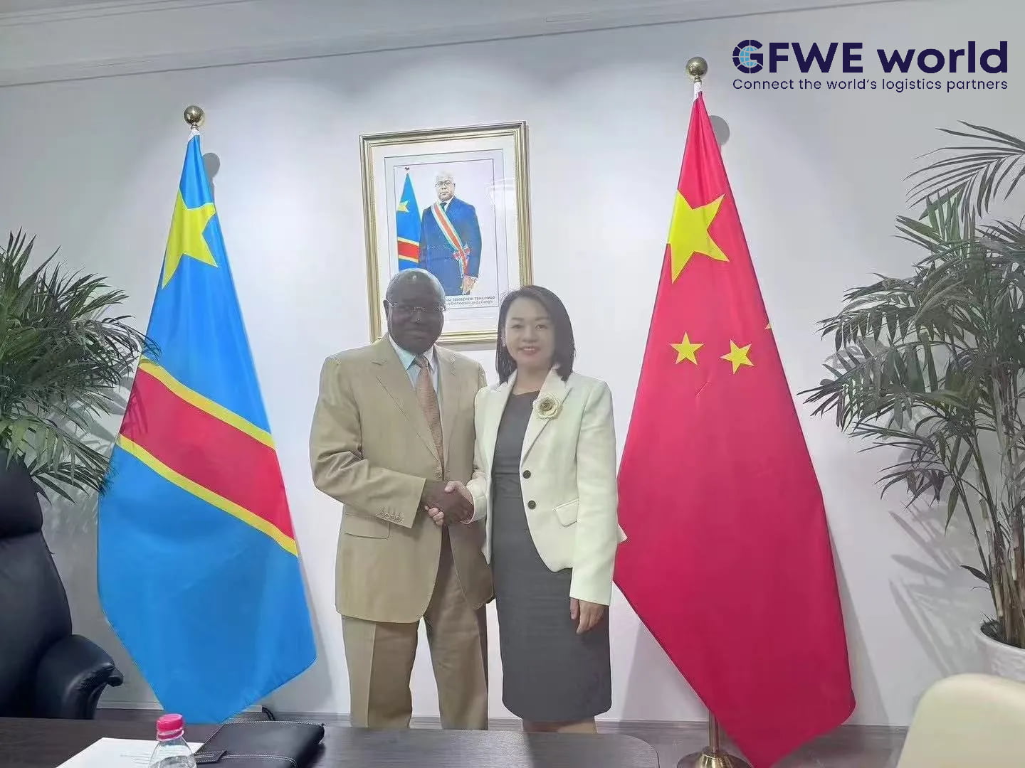 GFWE representative shaking hands with the DRC Ambassador to China at the embassy in Beijing